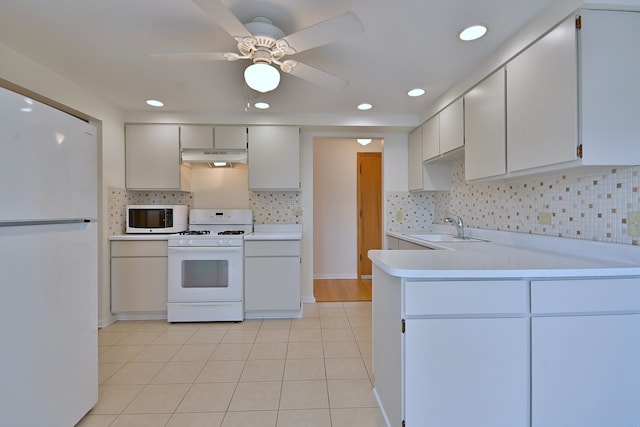 6959 W Higgins Ave Unit 3S, Chicago, IL 60656 - kitchen with white appliances, under cabinet range hood, light countertops, ceiling fan, and tasteful backsplash