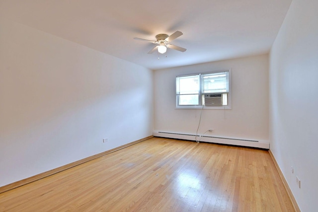 6959 W Higgins Ave Unit 3S, Chicago, IL 60656 - spare room featuring a baseboard radiator, cooling unit, ceiling fan, and light wood-type flooring