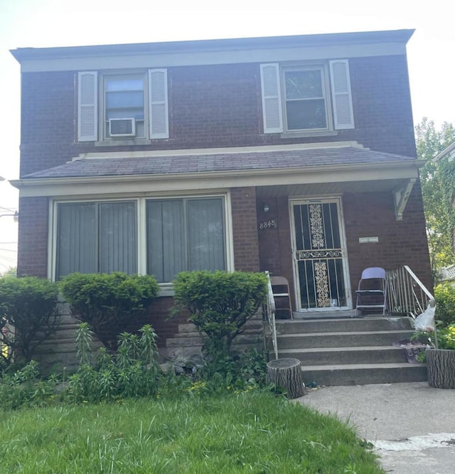 8848 S Jeffery Ave, Chicago, IL 60617 - view of front of house with brick siding and covered porch