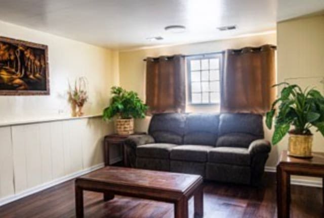 3208 172nd Ct, Hazel Crest, IL 60429 - living room featuring wood finished floors and a wainscoted wall