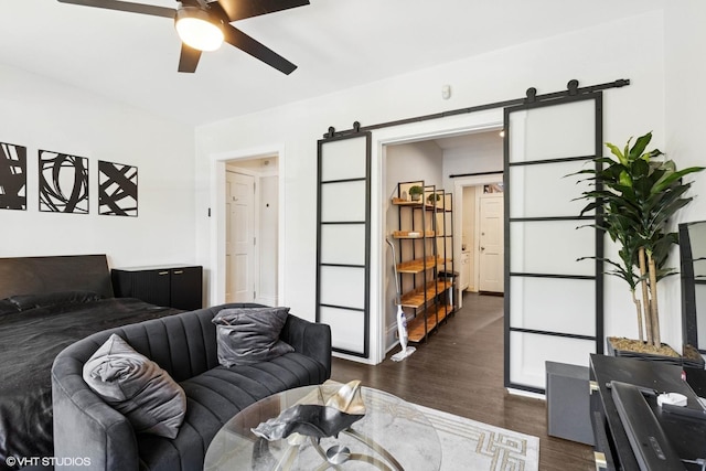 1709 W Wallen Ave Unit 1J, Chicago, IL 60626 - living room with a barn door, a ceiling fan, and dark wood-type flooring