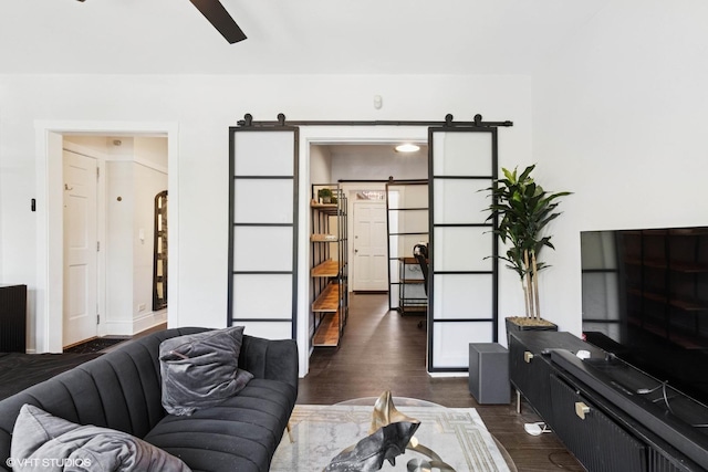 1709 W Wallen Ave Unit 1J, Chicago, IL 60626 - living area with a barn door, ceiling fan, and dark wood-style flooring