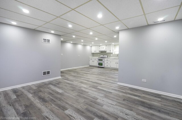 651 Clearmont Dr, Elk Grove Village, IL 60007 - unfurnished living room with wood finished floors, recessed lighting, and a drop ceiling