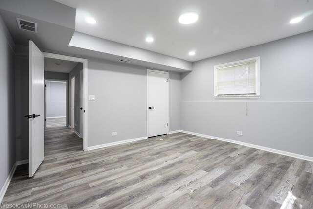 651 Clearmont Dr, Elk Grove Village, IL 60007 - basement with wood finished floors and recessed lighting