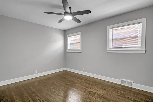 9007 S Cregier Ave, Chicago, IL 60617 - empty room featuring dark wood-style flooring and a ceiling fan