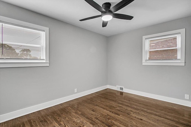 9007 S Cregier Ave, Chicago, IL 60617 - empty room featuring dark wood finished floors and a ceiling fan