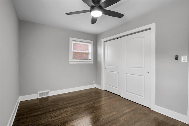 9007 S Cregier Ave, Chicago, IL 60617 - unfurnished bedroom featuring dark wood-style flooring, a closet, and a ceiling fan
