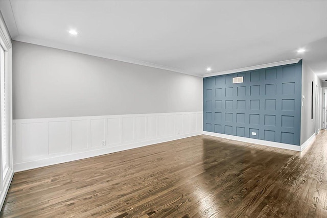 9007 S Cregier Ave, Chicago, IL 60617 - unfurnished room featuring ornamental molding, wood finished floors, a decorative wall, recessed lighting, and a wainscoted wall
