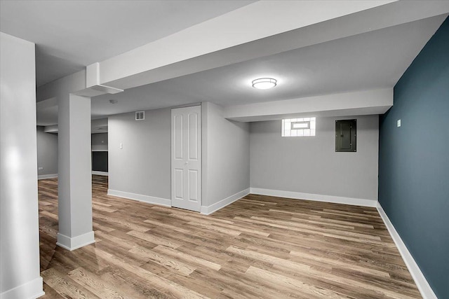 9007 S Cregier Ave, Chicago, IL 60617 - basement featuring electric panel and wood finished floors