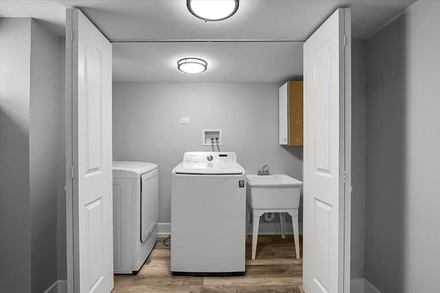9007 S Cregier Ave, Chicago, IL 60617 - laundry area featuring washing machine and clothes dryer, wood finished floors, and cabinet space