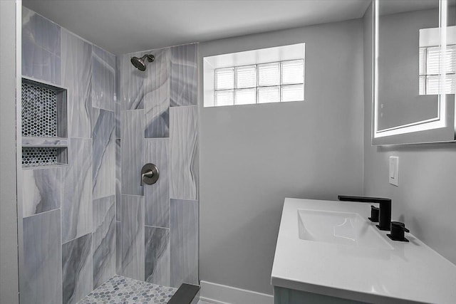 9007 S Cregier Ave, Chicago, IL 60617 - bathroom featuring vanity, plenty of natural light, and tiled shower