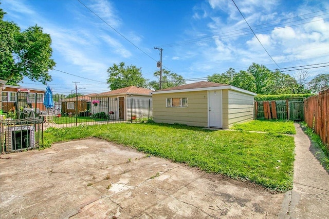 9007 S Cregier Ave, Chicago, IL 60617 - rear view of house featuring a fenced backyard and an outdoor structure