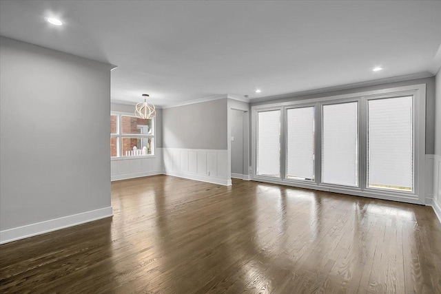 9007 S Cregier Ave, Chicago, IL 60617 - empty room featuring ornamental molding, dark wood-style floors, a wainscoted wall, and recessed lighting