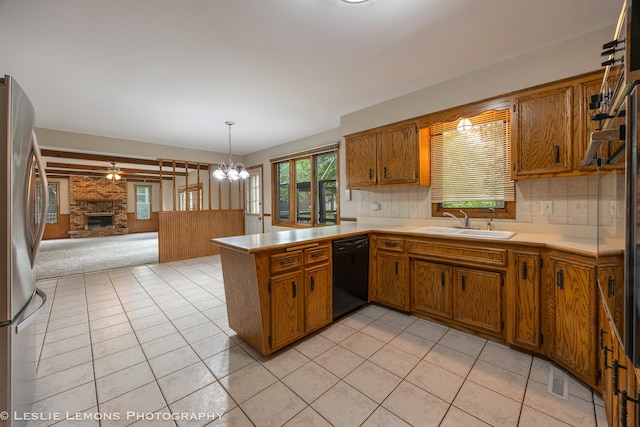13938 S Trails End Dr, Homer Glen, IL 60491 - kitchen featuring dishwasher, open floor plan, freestanding refrigerator, and brown cabinets