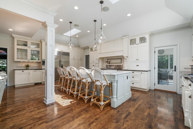 2135 Kenton Ln, Libertyville, IL 60048 - kitchen with stainless steel built in fridge, a skylight, backsplash, recessed lighting, and ornamental molding