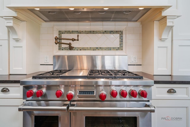 2135 Kenton Ln, Libertyville, IL 60048 - kitchen view of extractor fan, tasteful backsplash, white cabinets, and pot filler