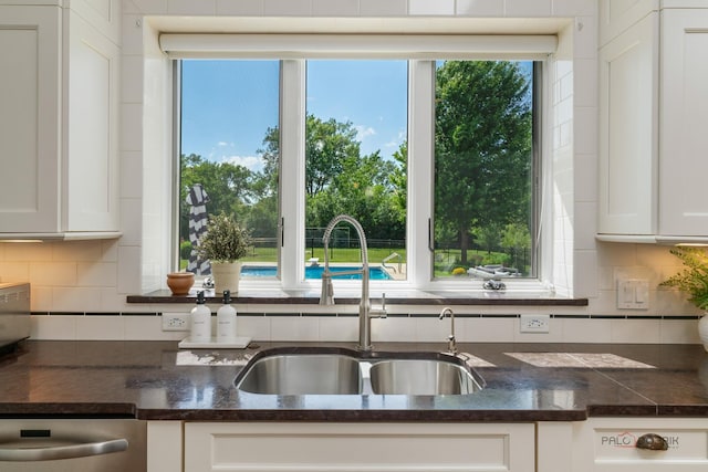 2135 Kenton Ln, Libertyville, IL 60048 - kitchen featuring dark countertops, white cabinetry, and healthy amount of natural light