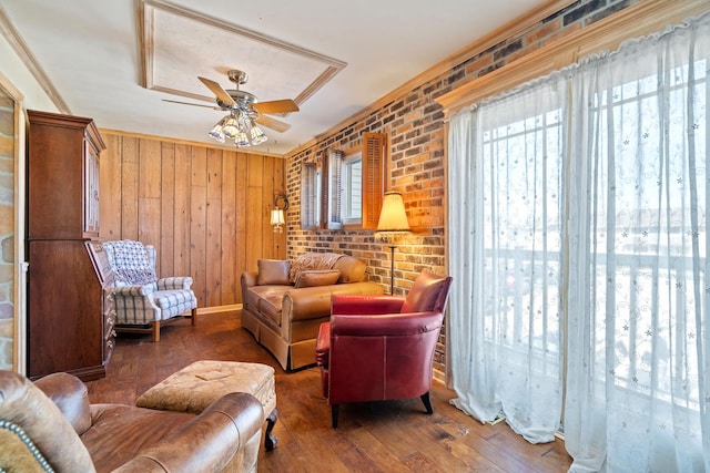 1003 Sandpiper Ct, Bartlett, IL 60103 - living room featuring hardwood / wood-style flooring, ceiling fan, ornamental molding, and wooden walls
