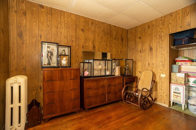 5028 N Sawyer Ave, Chicago, IL 60625 - sitting room featuring radiator, wood finished floors, and wood walls