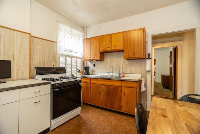 5028 N Sawyer Ave, Chicago, IL 60625 - kitchen with gas range, brown cabinetry, and butcher block countertops