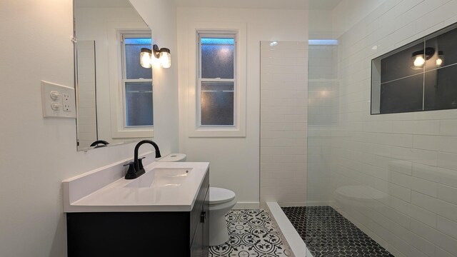 5028 W Lawrence Ave, Chicago, IL 60630 - bathroom featuring vanity, a walk in shower, and tile patterned floors