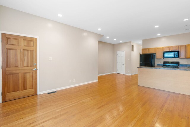 5028 W Lawrence Ave, Chicago, IL 60630 - unfurnished living room featuring light wood finished floors and recessed lighting