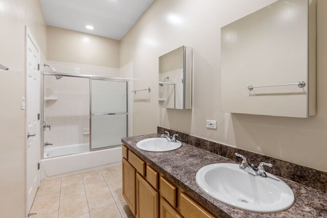 5028 W Lawrence Ave, Chicago, IL 60630 - bathroom featuring bath / shower combo with glass door, double vanity, and tile patterned floors