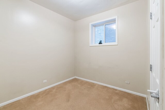 5028 W Lawrence Ave, Chicago, IL 60630 - spare room featuring light carpet and baseboards