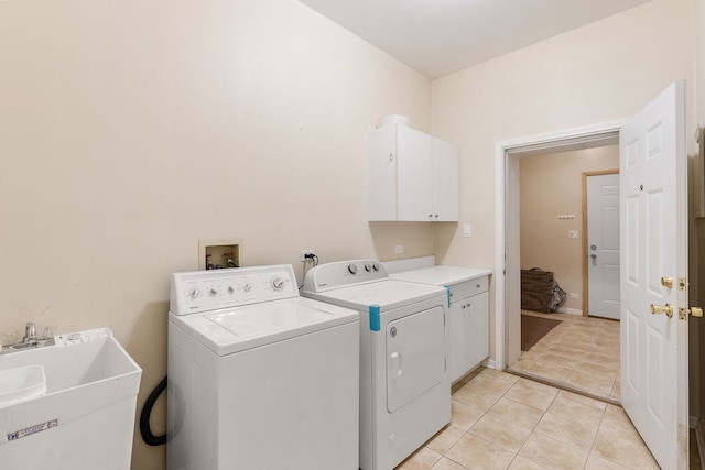 5028 W Lawrence Ave, Chicago, IL 60630 - laundry room with cabinet space, washing machine and dryer, and light tile patterned floors