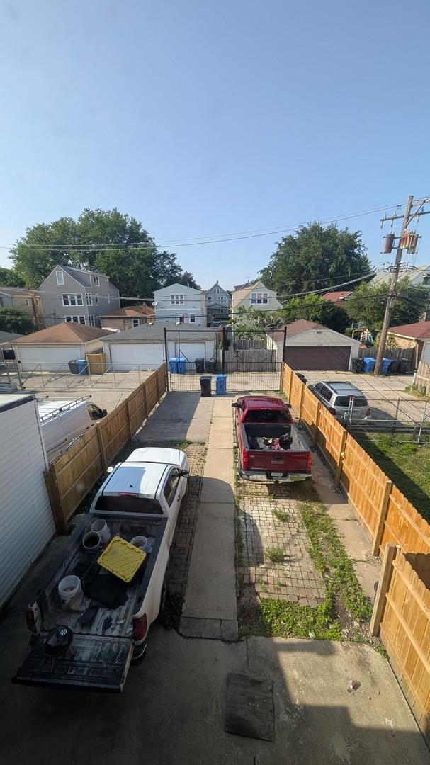 5028 W Lawrence Ave, Chicago, IL 60630 - view of front of house with a fenced backyard