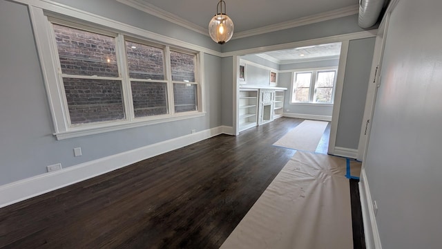 5028 W Lawrence Ave, Chicago, IL 60630 - unfurnished dining area with crown molding and dark wood-type flooring