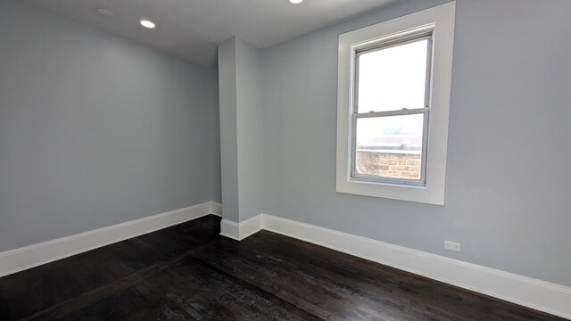 5028 W Lawrence Ave, Chicago, IL 60630 - empty room with dark wood finished floors and recessed lighting