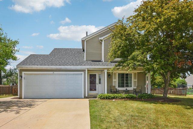 11 Misty Ct, South Elgin, IL 60177 - view of front facade featuring driveway, an attached garage, a porch, and a shingled roof