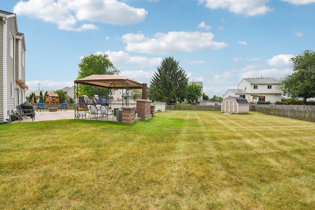 11 Misty Ct, South Elgin, IL 60177 - fenced backyard featuring a gazebo, a storage unit, and a patio area