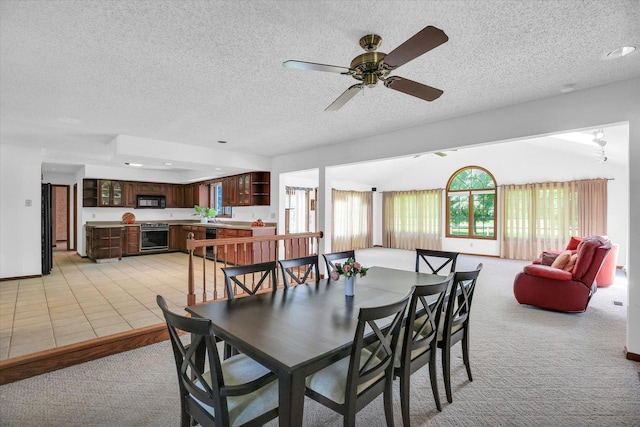 2904 Robeson Park Dr, Champaign, IL 61822 - dining room with light colored carpet, a textured ceiling, and ceiling fan