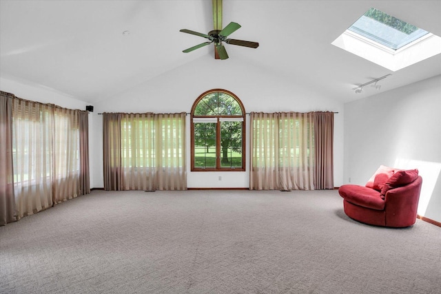 2904 Robeson Park Dr, Champaign, IL 61822 - sitting room featuring a skylight, carpet floors, ceiling fan, and high vaulted ceiling