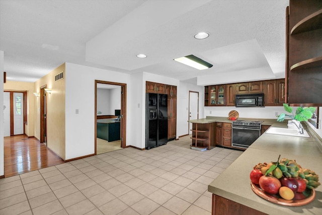 2904 Robeson Park Dr, Champaign, IL 61822 - kitchen featuring black appliances, open shelves, light countertops, recessed lighting, and light tile patterned floors