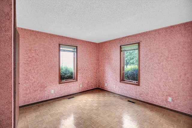 2904 Robeson Park Dr, Champaign, IL 61822 - unfurnished room with plenty of natural light and a textured ceiling