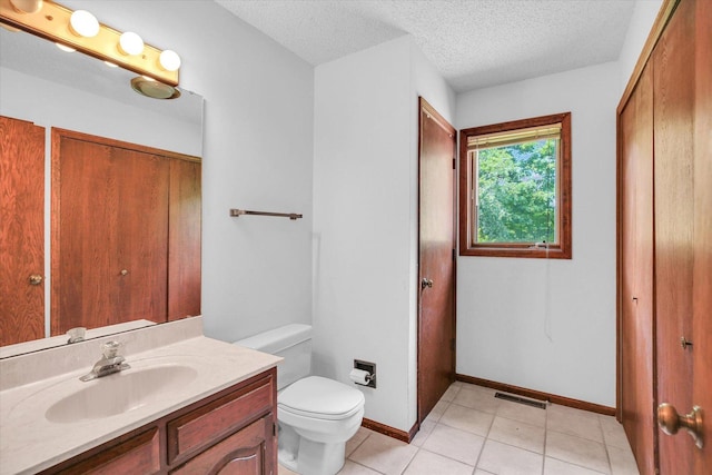 2904 Robeson Park Dr, Champaign, IL 61822 - bathroom with vanity, a textured ceiling, and tile patterned flooring