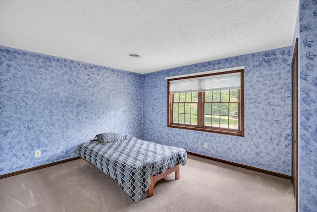2904 Robeson Park Dr, Champaign, IL 61822 - carpeted bedroom with a textured ceiling and baseboards