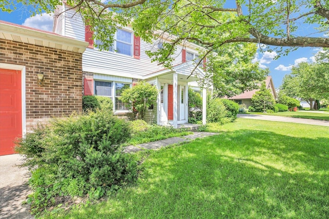 2904 Robeson Park Dr, Champaign, IL 61822 - view of front of home featuring a front yard, brick siding, and a chimney
