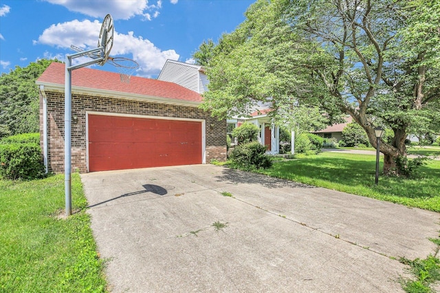 2904 Robeson Park Dr, Champaign, IL 61822 - obstructed view of property featuring brick siding, a front yard, concrete driveway, a garage, and a shingled roof