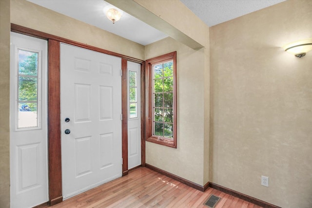 2904 Robeson Park Dr, Champaign, IL 61822 - foyer entrance with light wood-style flooring and baseboards