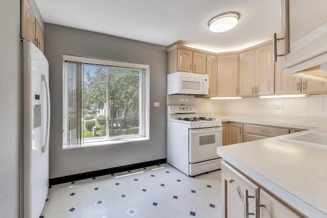 900 E Wilmette Rd Unit 205, Palatine, IL 60074 - kitchen featuring white appliances, light brown cabinets, light countertops, and decorative backsplash