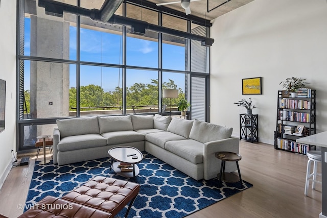 1800 W Grace St Unit 523, Chicago, IL 60613 - living area featuring a high ceiling, wood finished floors, and floor to ceiling windows