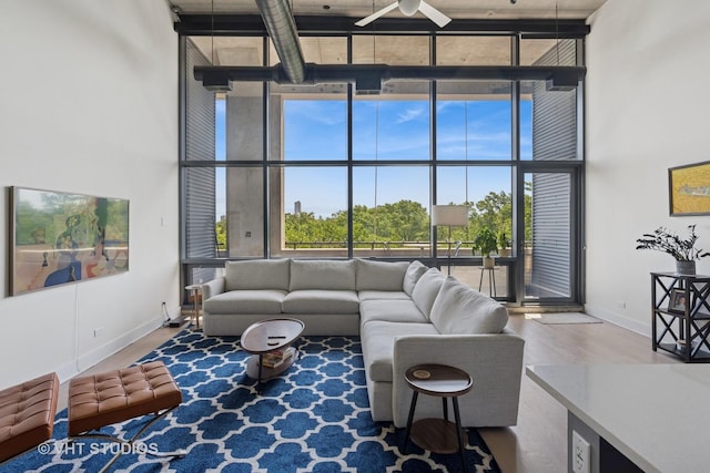 1800 W Grace St Unit 523, Chicago, IL 60613 - living area with a wall of windows, a high ceiling, wood finished floors, and a ceiling fan