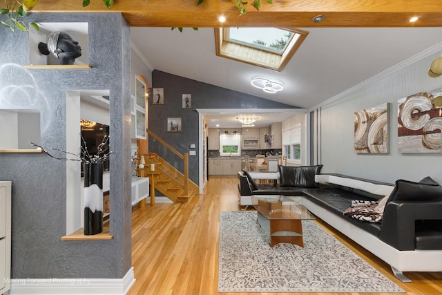 1145 S Chestnut Ave, Arlington Heights, IL 60005 - living room featuring ornamental molding, stairway, a skylight, light wood-style flooring, and vaulted ceiling