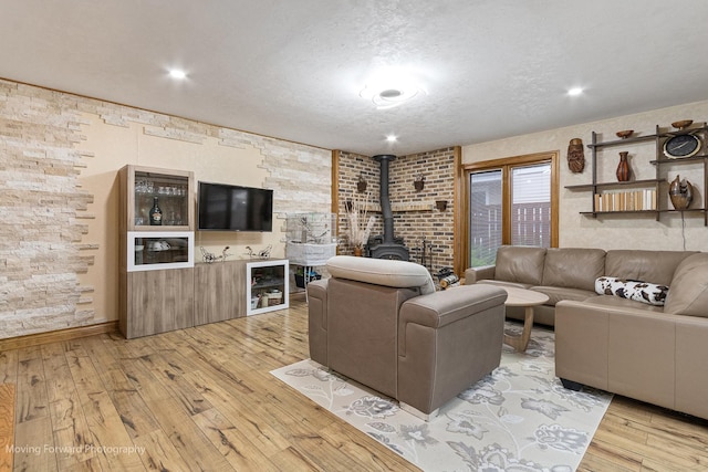 1145 S Chestnut Ave, Arlington Heights, IL 60005 - living area featuring a wood stove, light wood finished floors, and a textured ceiling
