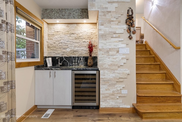 1145 S Chestnut Ave, Arlington Heights, IL 60005 - indoor bar with beverage cooler, stairs, and wood finished floors