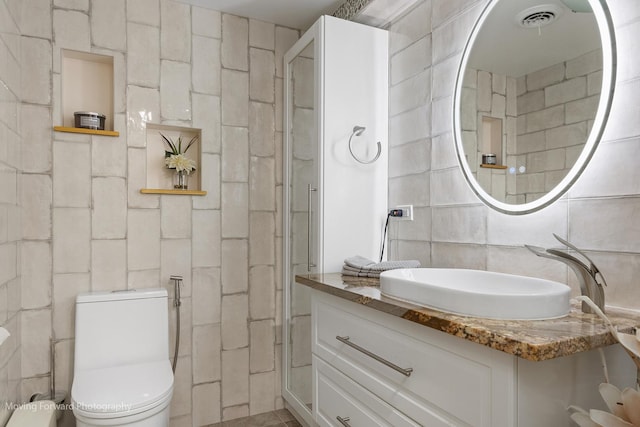 1145 S Chestnut Ave, Arlington Heights, IL 60005 - full bath featuring tile walls, vanity, decorative backsplash, and a shower stall